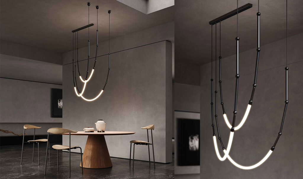Karman Leda pendant, pair of curved fixtures above a dining table