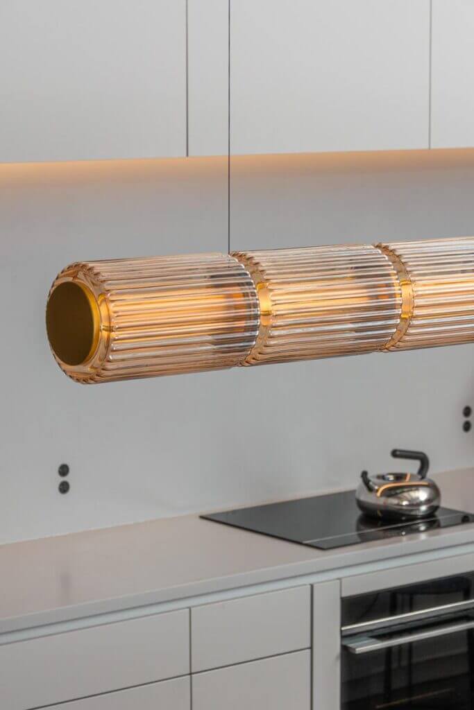 A-N-D Light Column pendant, lit detail above a kitchen counter