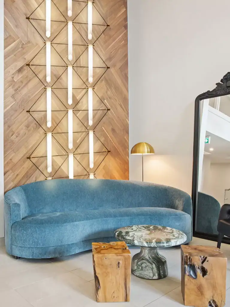 Designheure Mozaik pendant in white above a blue sofa