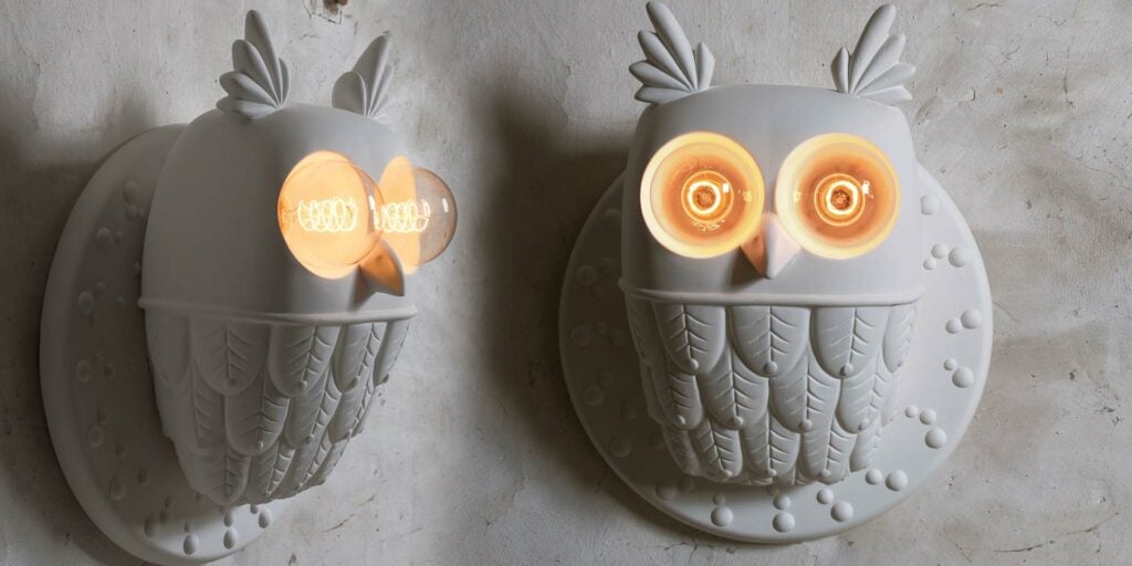 Karman Ti.Vedo wall light, two owl-shaped fixtures lit side by side