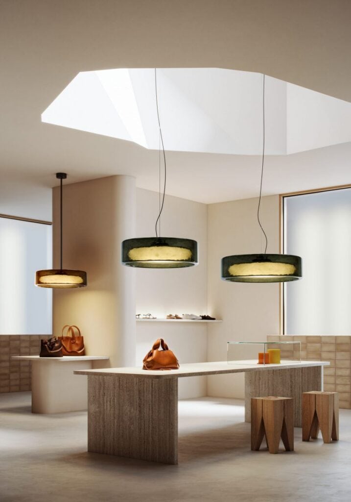 Marset Ringo pendant cluster above a retail display island