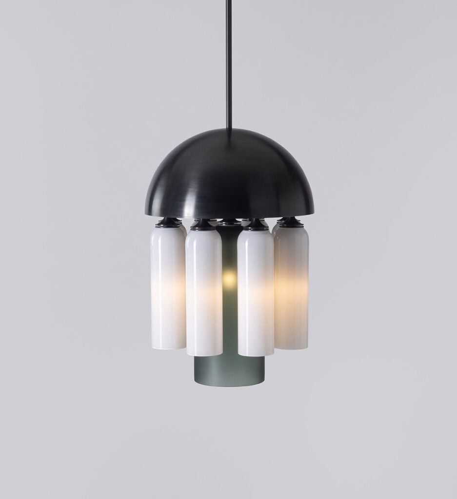 Modern pendant light with black dome and white glass shades.
