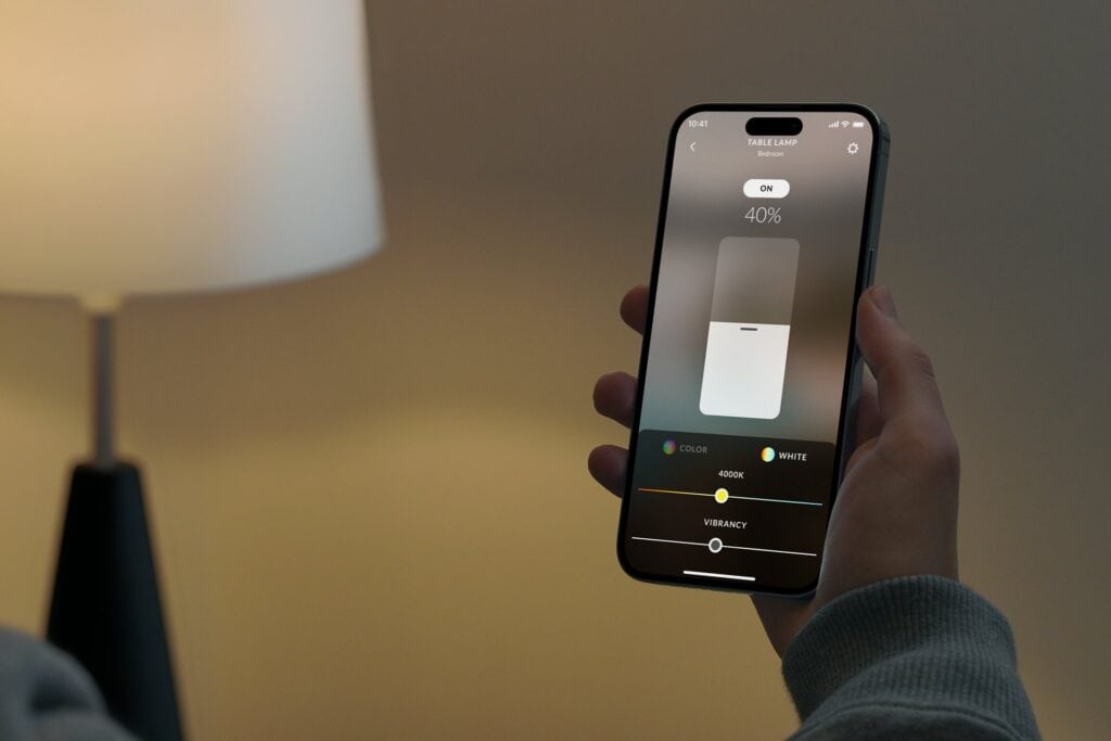 Adjusting a light on the Josh.ai app on a phone held in hand