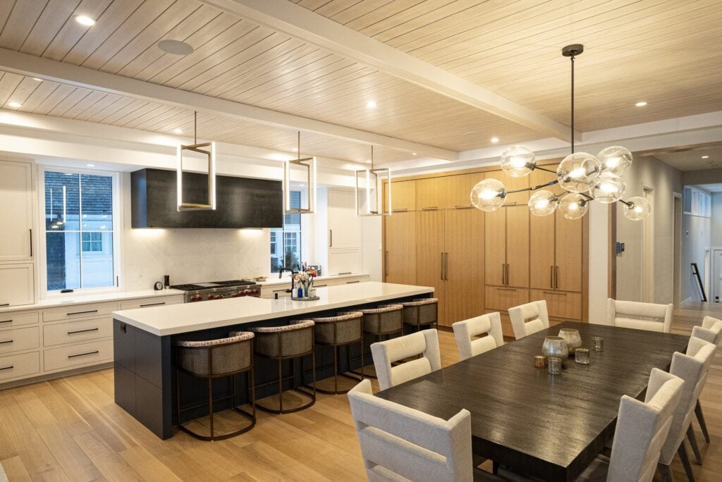 Warm wood lakehouse kitchen with Sonance speakers hidden in the architecture