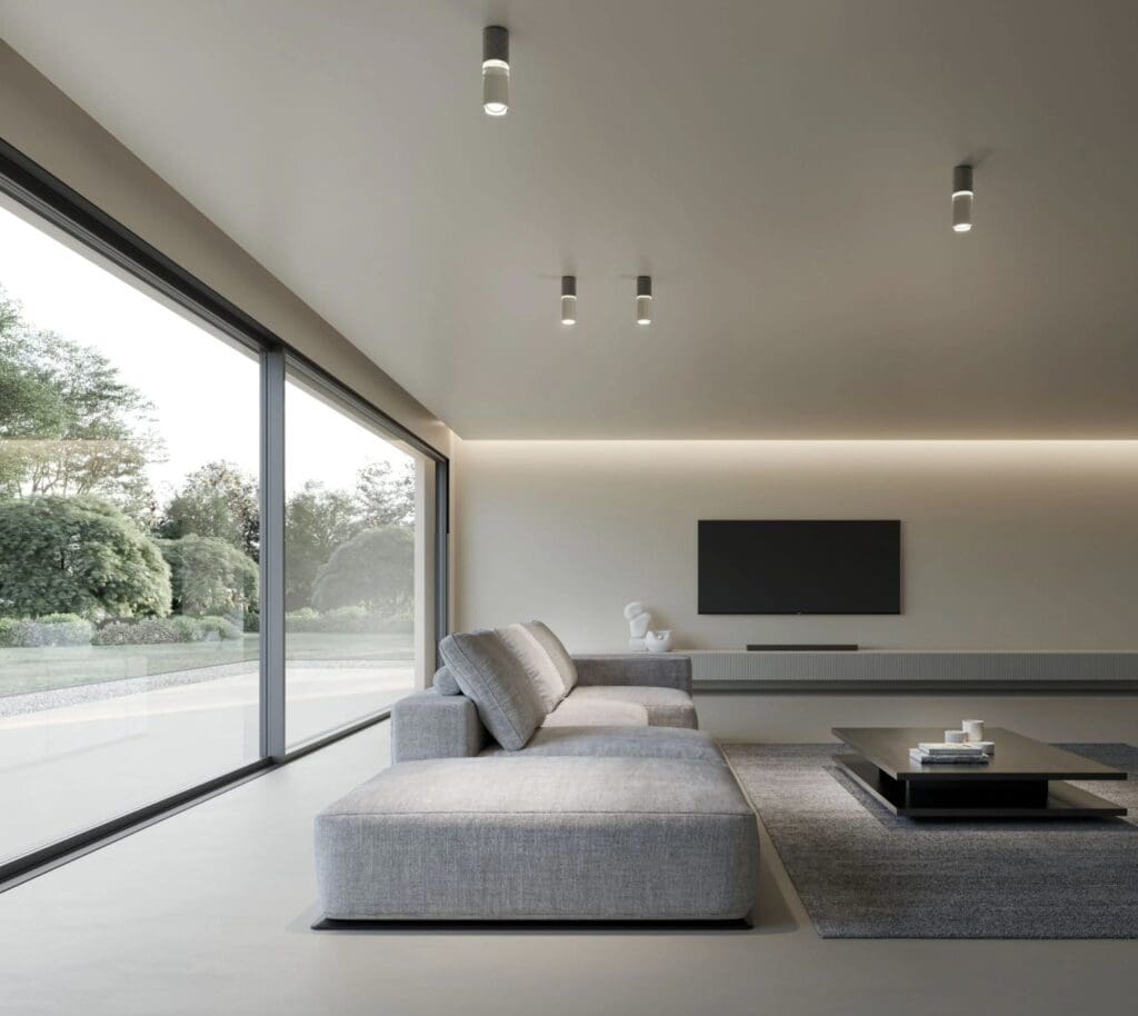 Karman Smug ceiling lights over a living room with a grey sofa