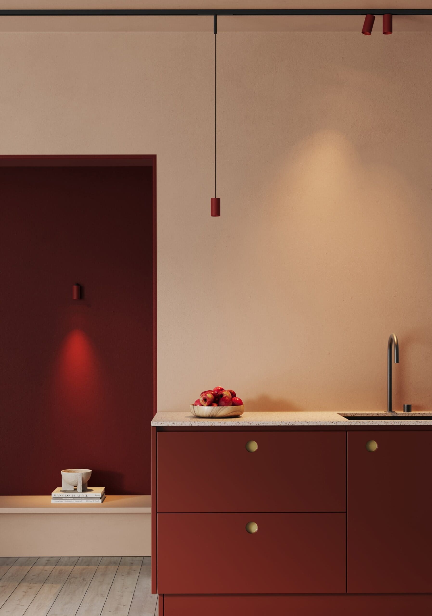 Modular Minude pendant beside red kitchen cabinets